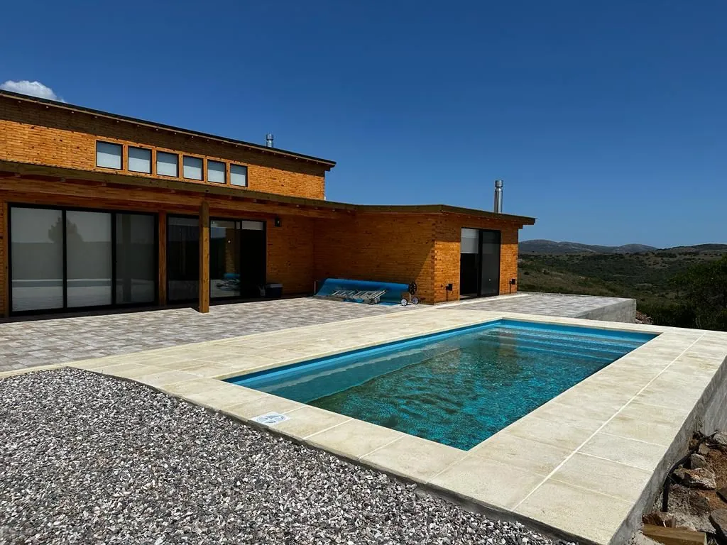 Natural wood house with pool